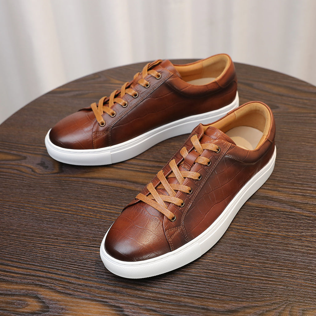 Men's brown genuine leather sneakers, pair view with tan laces and white rubber sole.