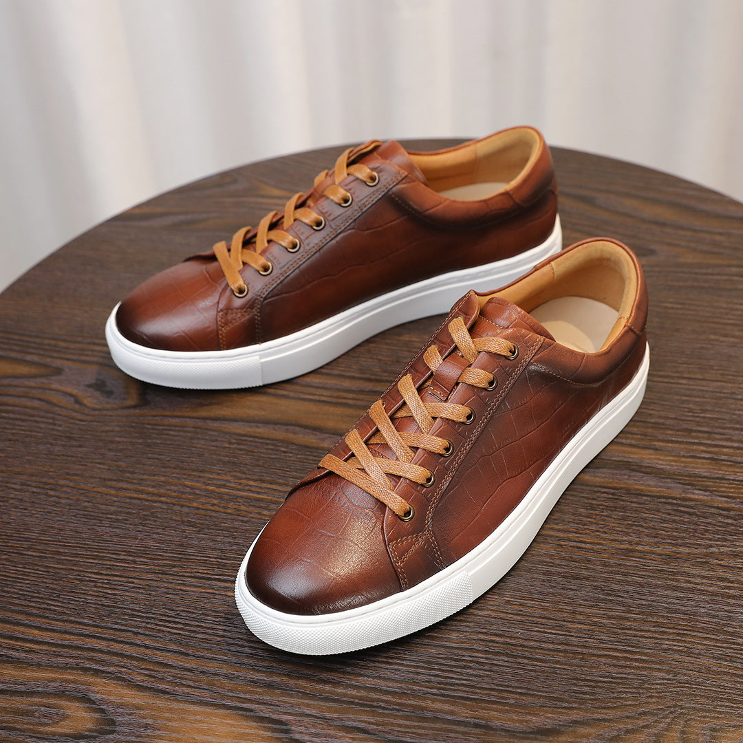 Men's brown genuine leather sneakers, pair view with tan laces and white rubber sole.