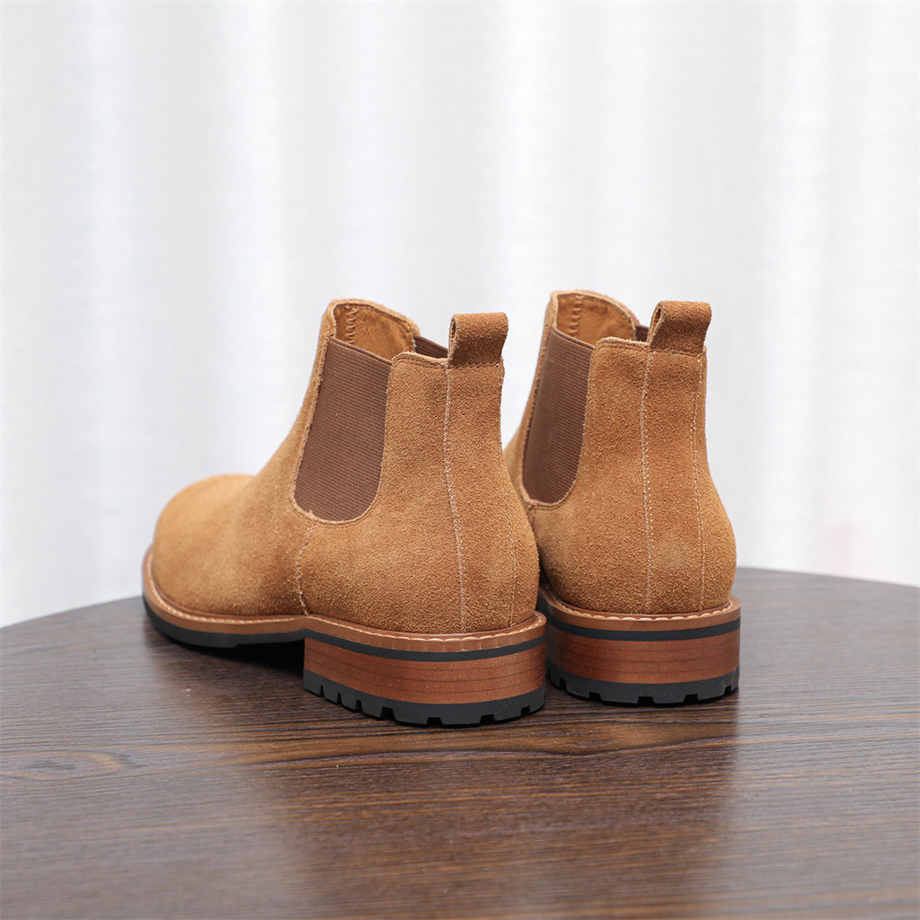 Pair of men's suede chelsea dress boots in tan/brown with stacked heel and side elastic