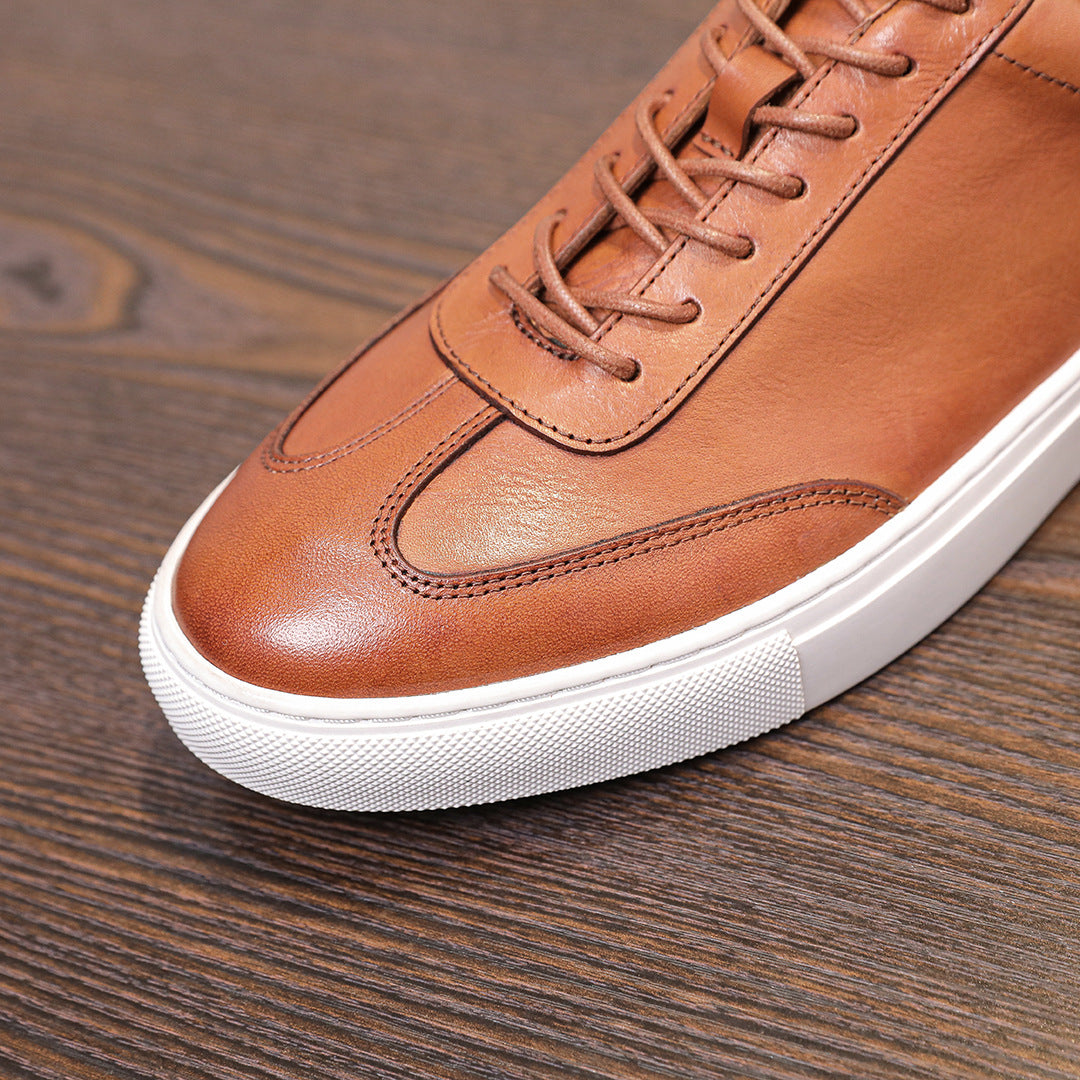 Brown leather lace-up sneaker with stitched toe cap and white rubber midsole