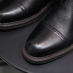 Men's pointed-toe Chelsea dress boots, black upper with elastic gore and stitched edge