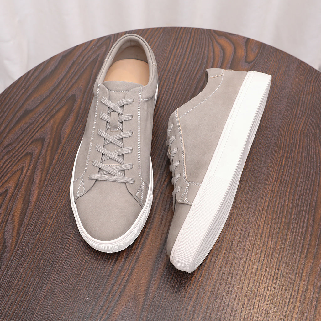 Gray suede leather sneaker pair, side and heel views with white platform soles