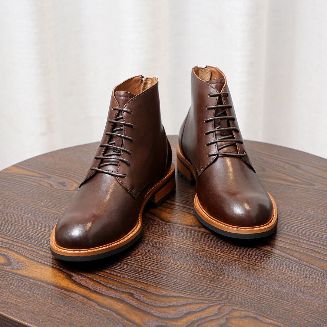Pair of dark brown leather pointed-toe lace-up ankle boots with tan welt and stitched uppers