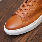 Men's leather sneakers, brown/cognac, side view with lace-up and textured upper