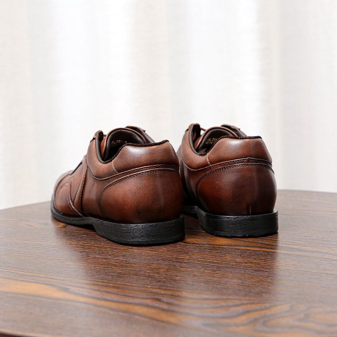 Men's brown leather sneakers back view showing heel tabs and low rubber sole