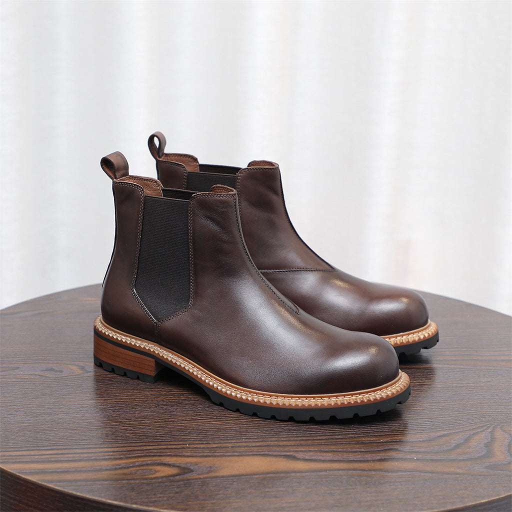 Dark brown Chelsea dress boots with pointed toe, elastic side gore, and low heel