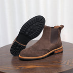 Brown suede pointed-toe Chelsea boots with elastic side panels and rubber sole