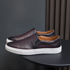 Men's dark purple leather slip-on sneakers with perforated upper and white rubber sole