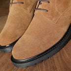 Men's brown plain-toe leather lace-up chukka boots with black rubber sole