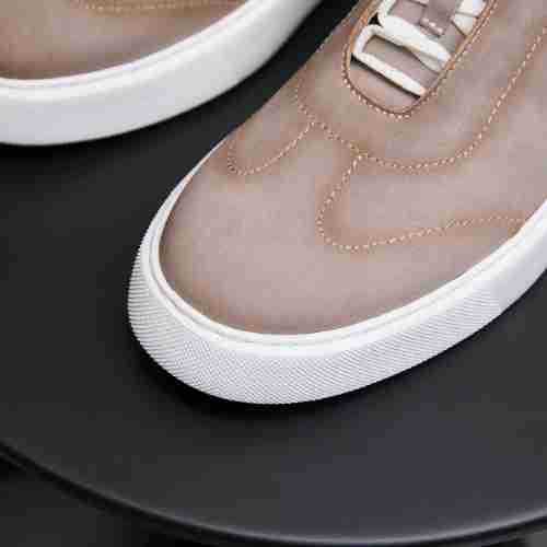 Light taupe leather sneaker toe with textured sole edge and white rubber sidewall
