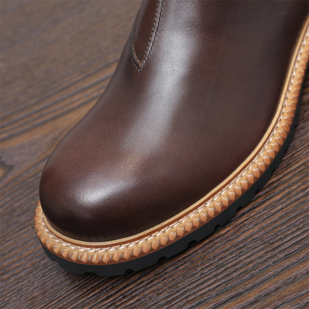 Men's pointed-toe Chelsea dress boots, dark brown upper with textured tan welt and sole
