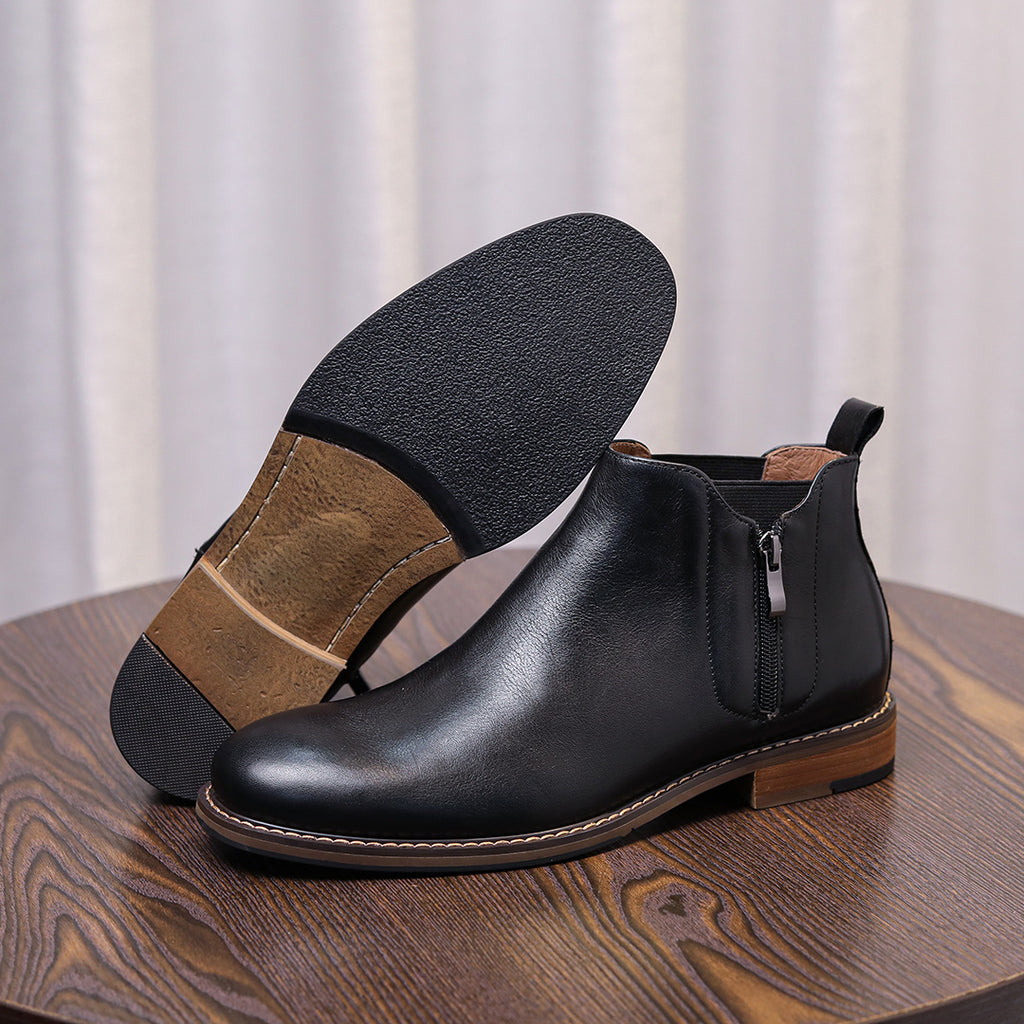 Men's black leather side-zip dress boots shown from side with pointed cap toe