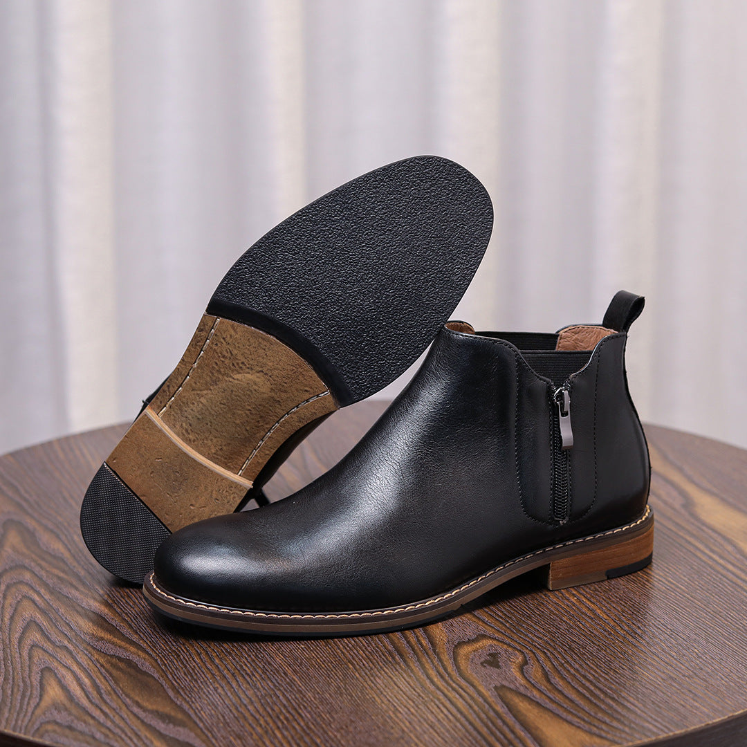 Men's black leather side-zip dress boots shown from side with pointed cap toe