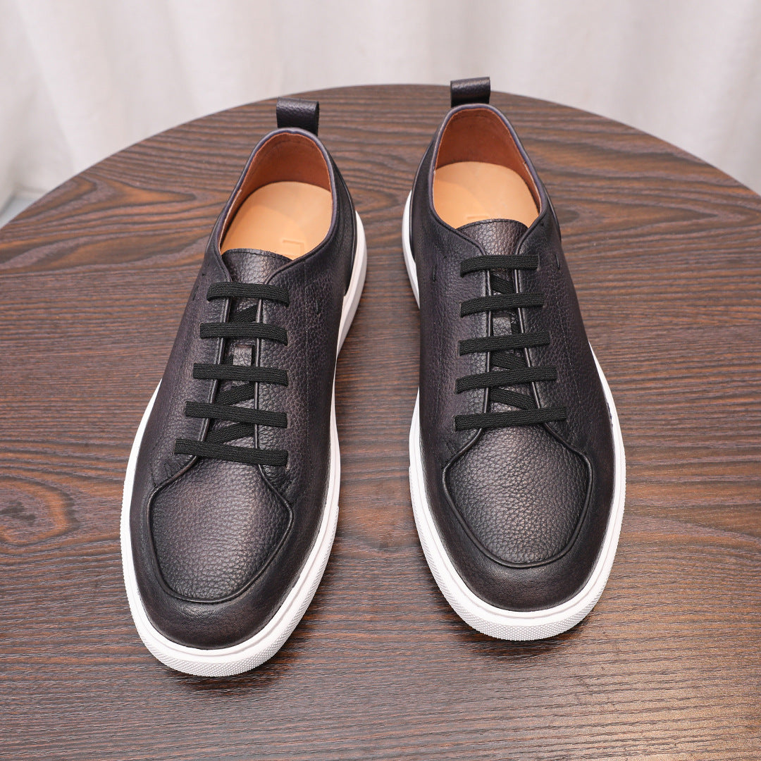 Black leather lace-up low-top sneakers with white rubber sole and dark padded collar