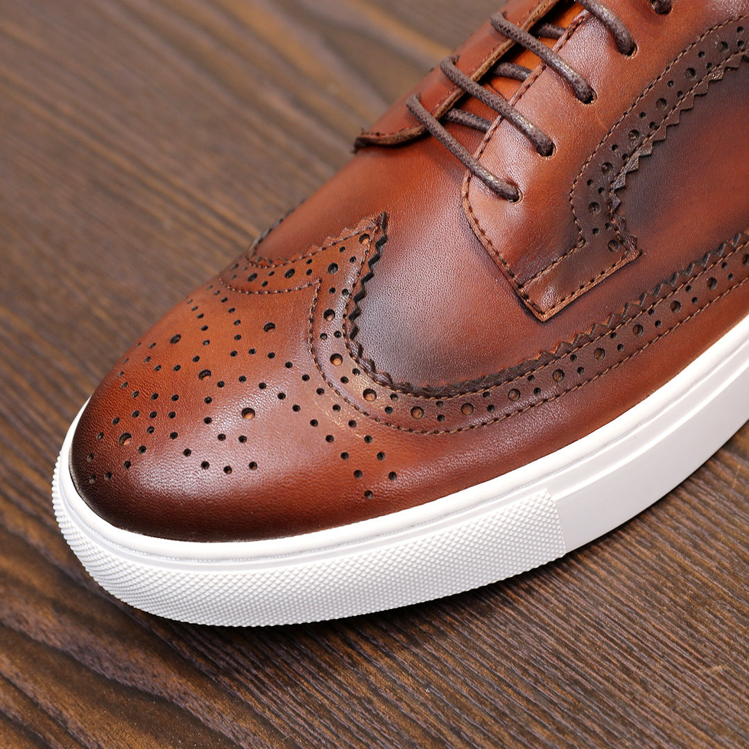Brown leather sneaker toe with perforated pattern and white rubber sole
