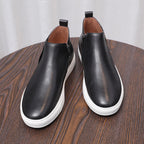 Men's point-toe leather side-zip dress boots, black uppers with side zipper and white edging