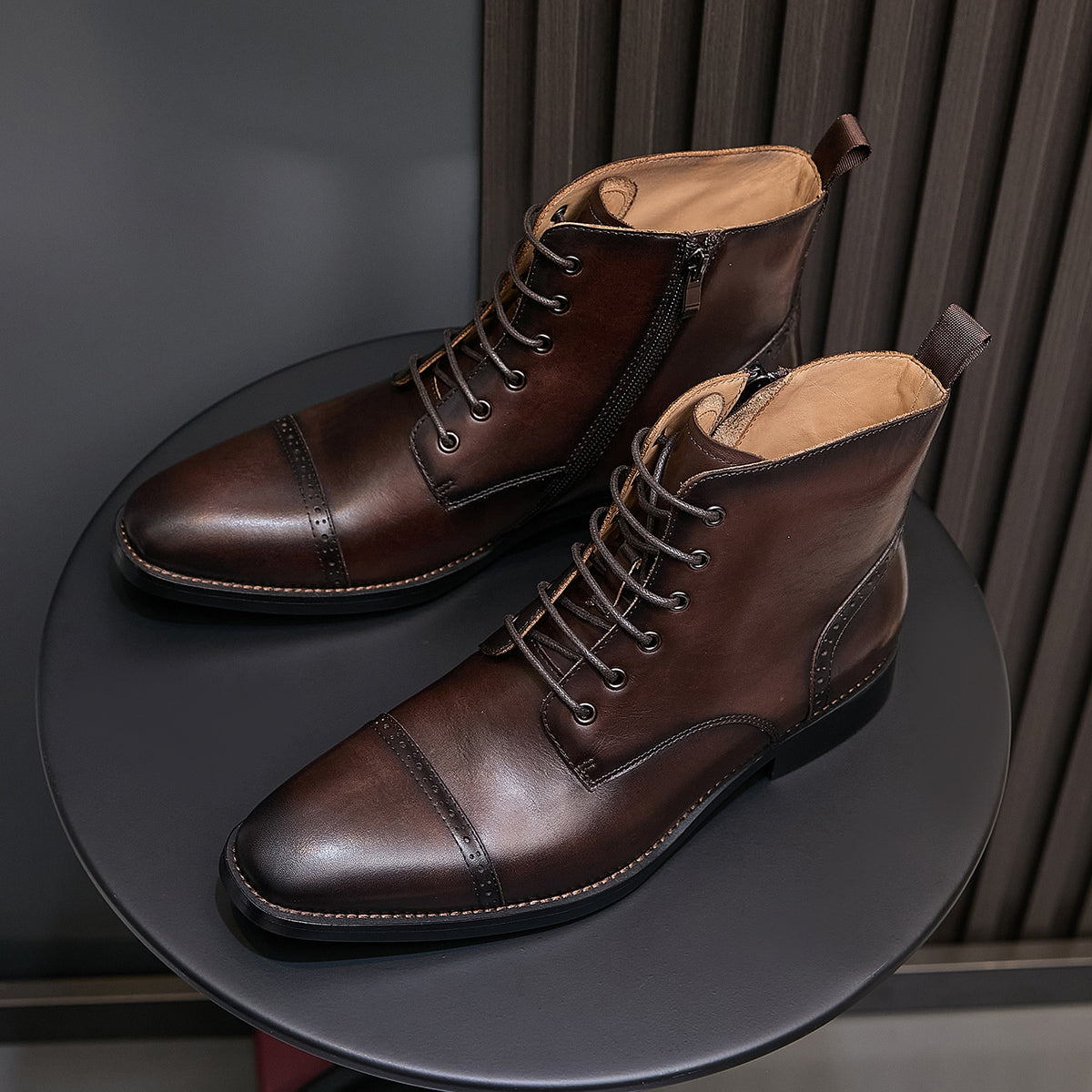 Dark brown leather pointed-toe ankle boots, lace-up front and side zipper, stacked heel