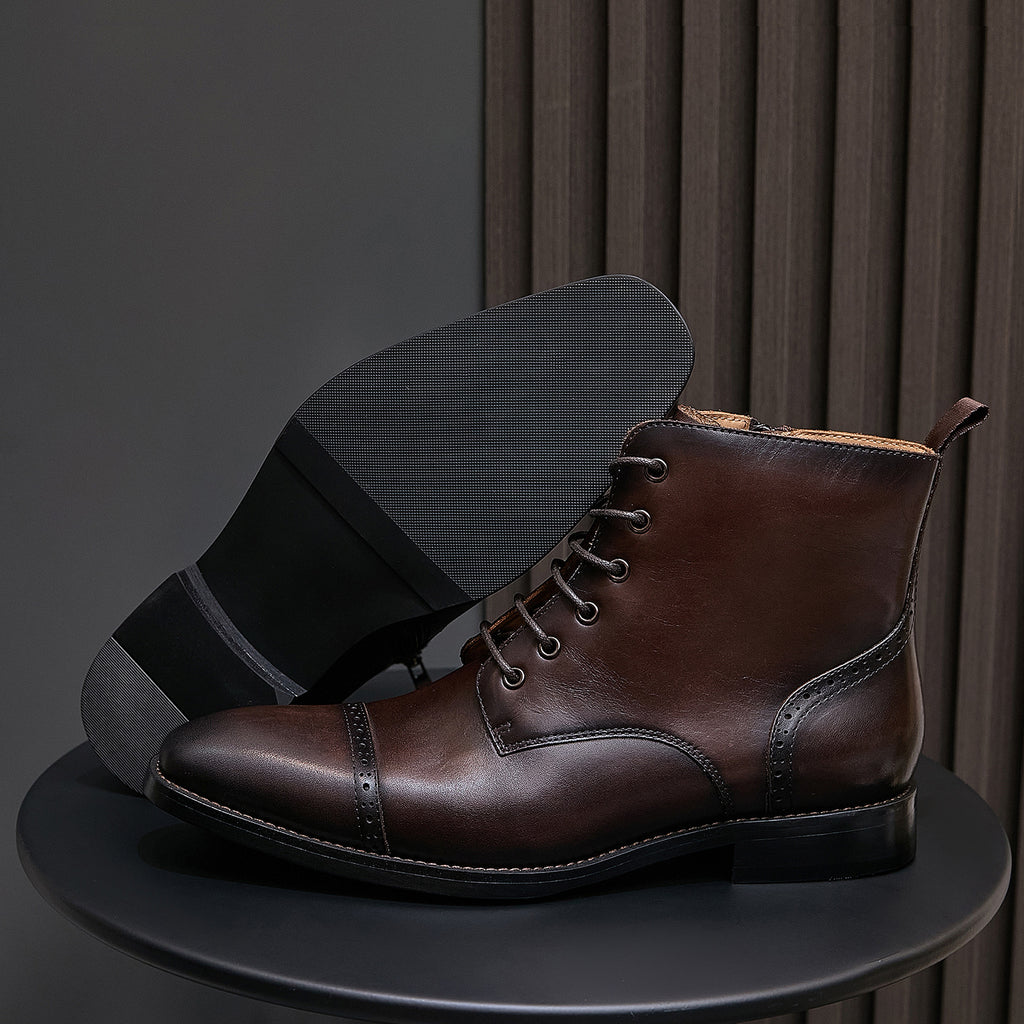 Dark brown pointed-toe leather boot, lace-up front with side zipper and stitched toe detail