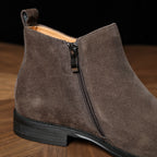 Men's point-toe leather side-zip dress boot in dark brown suede, side view