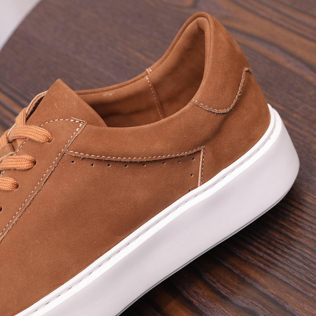 Men's brown suede leather sneaker with stitched side panel and white sole