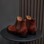 Dark brown suede Chelsea dress boots with pointed toe and elastic side gore