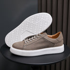 Men's gray leather sneakers, lace-up design with textured white outsole
