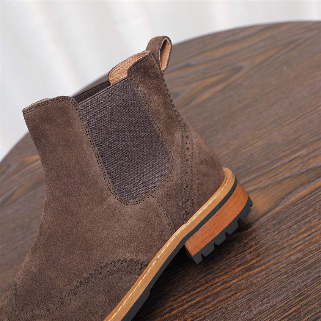 Brown suede Chelsea boot with elastic gore panels and lace-up style stitching