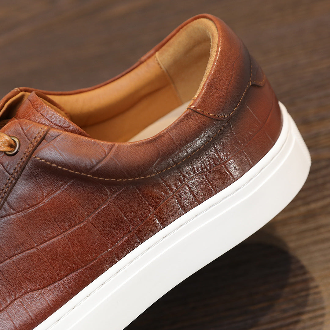 Men's brown leather sneakers, low-top with lace-up and minimalist stitched panels