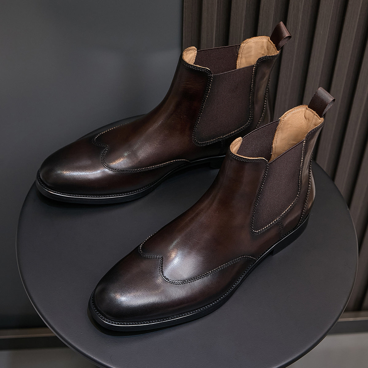 Men's pointed-toe Chelsea dress boots in dark brown, pair view with tan lining
