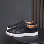 Men’s black leather lace-up sneakers with white rubber sole, low-top casual design
