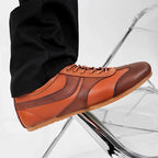Men's brown leather sneakers with lace-up closure and gum rubber sole