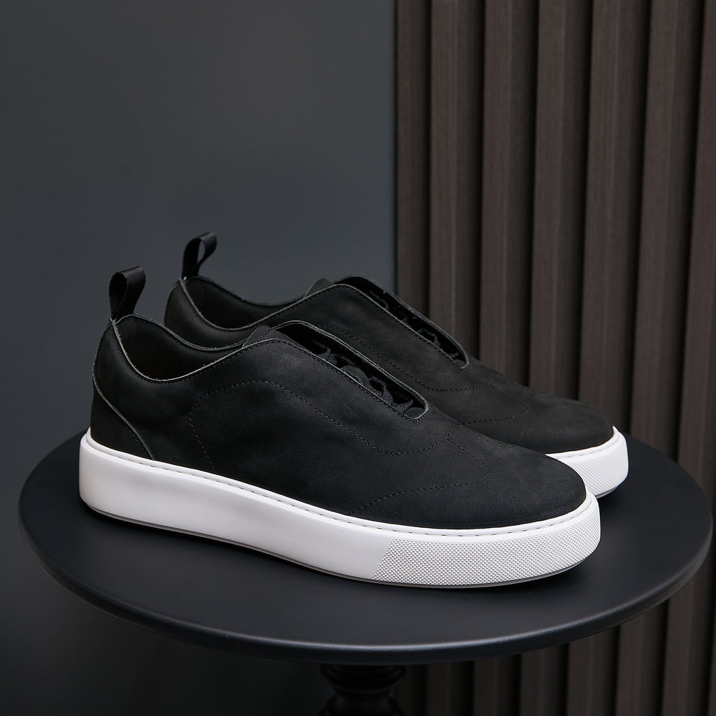 Men's genuine leather sneakers in black, low profile with white rubber sole.