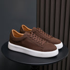 Men's dark brown leather sneakers with lace-up upper and white platform sole