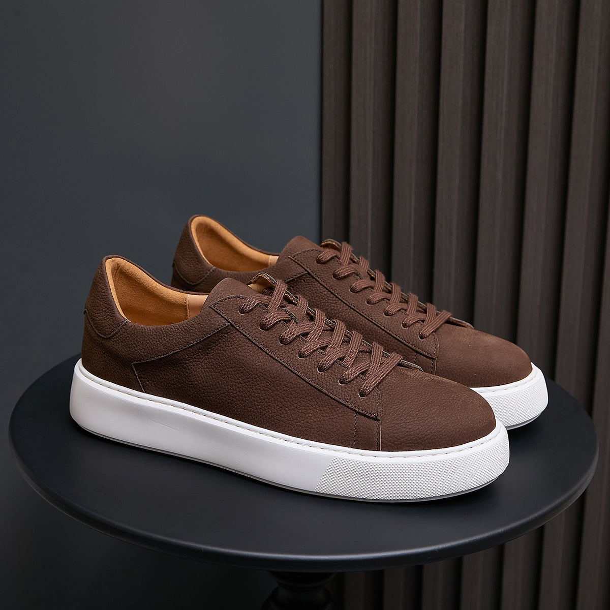 Men's dark brown leather sneakers with lace-up upper and white platform sole