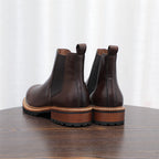Men's pointed-toe Chelsea dress boots, pair in dark brown with rugged tread and tan edge