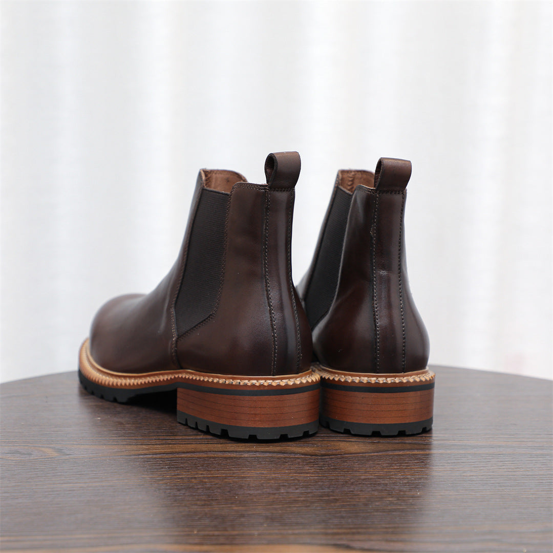 Men's pointed-toe Chelsea dress boots, pair in dark brown with rugged tread and tan edge