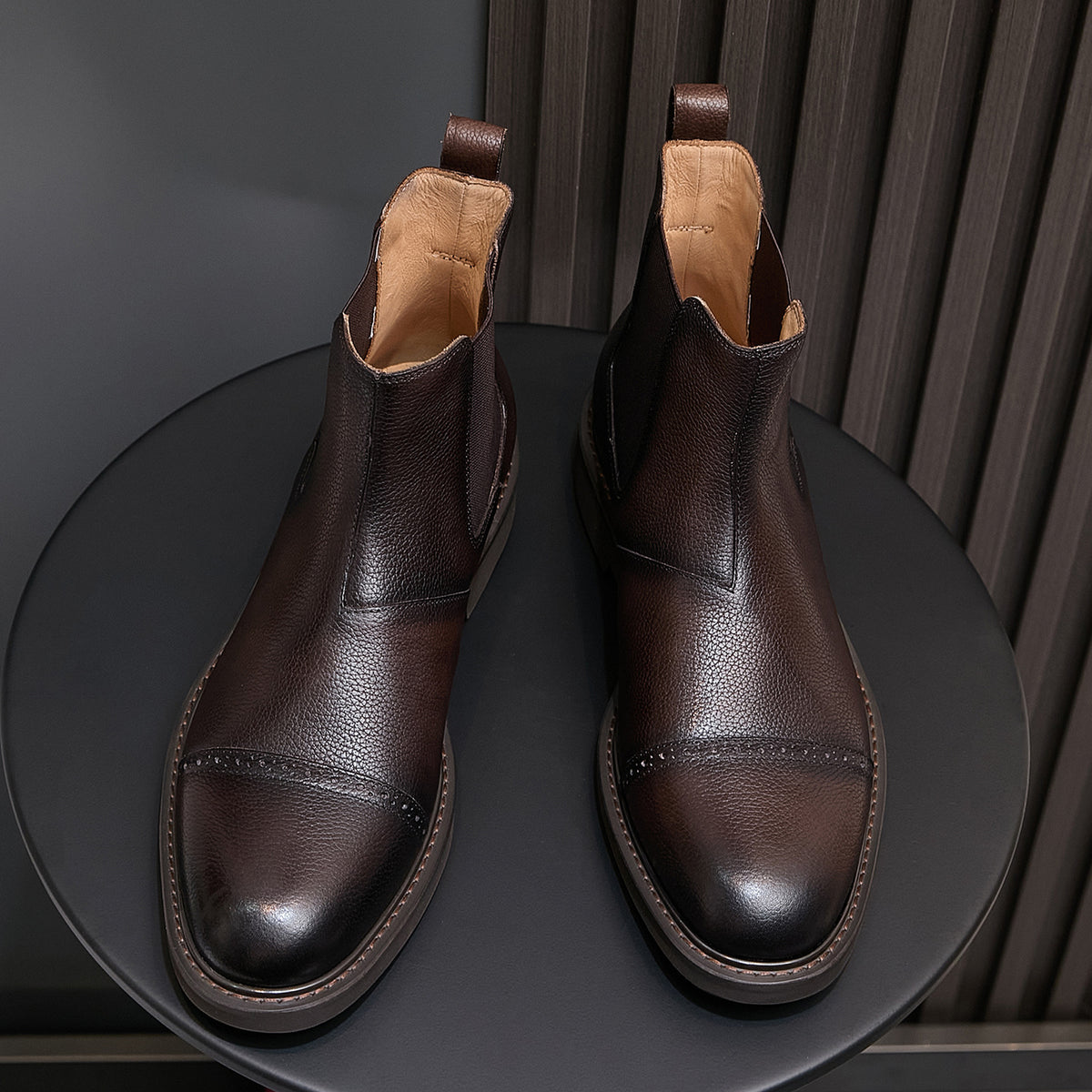 Men's pointed-toe Chelsea dress boots pair, dark brown leather look with elastic gore