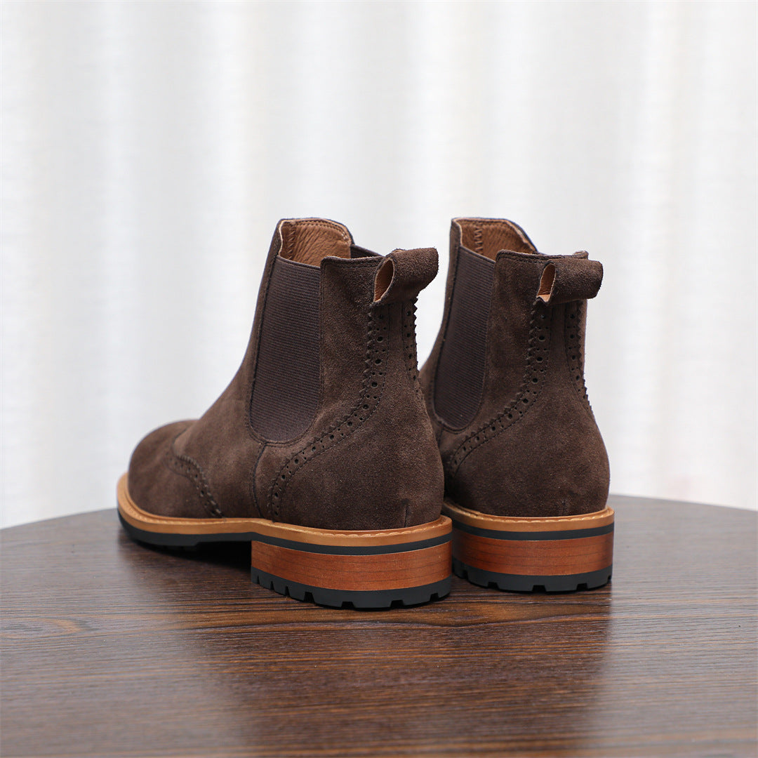 Pair of brown suede pointed-toe Chelsea boots with elastic side panels and low heel