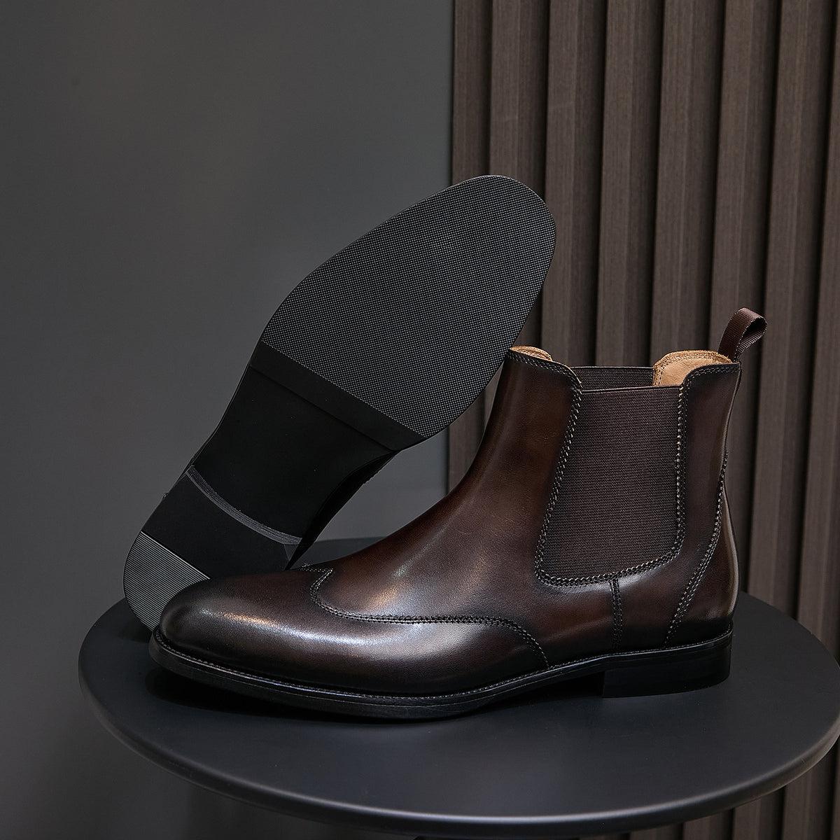 Men's pointed-toe Chelsea dress boot in dark brown, side view with wide block heel
