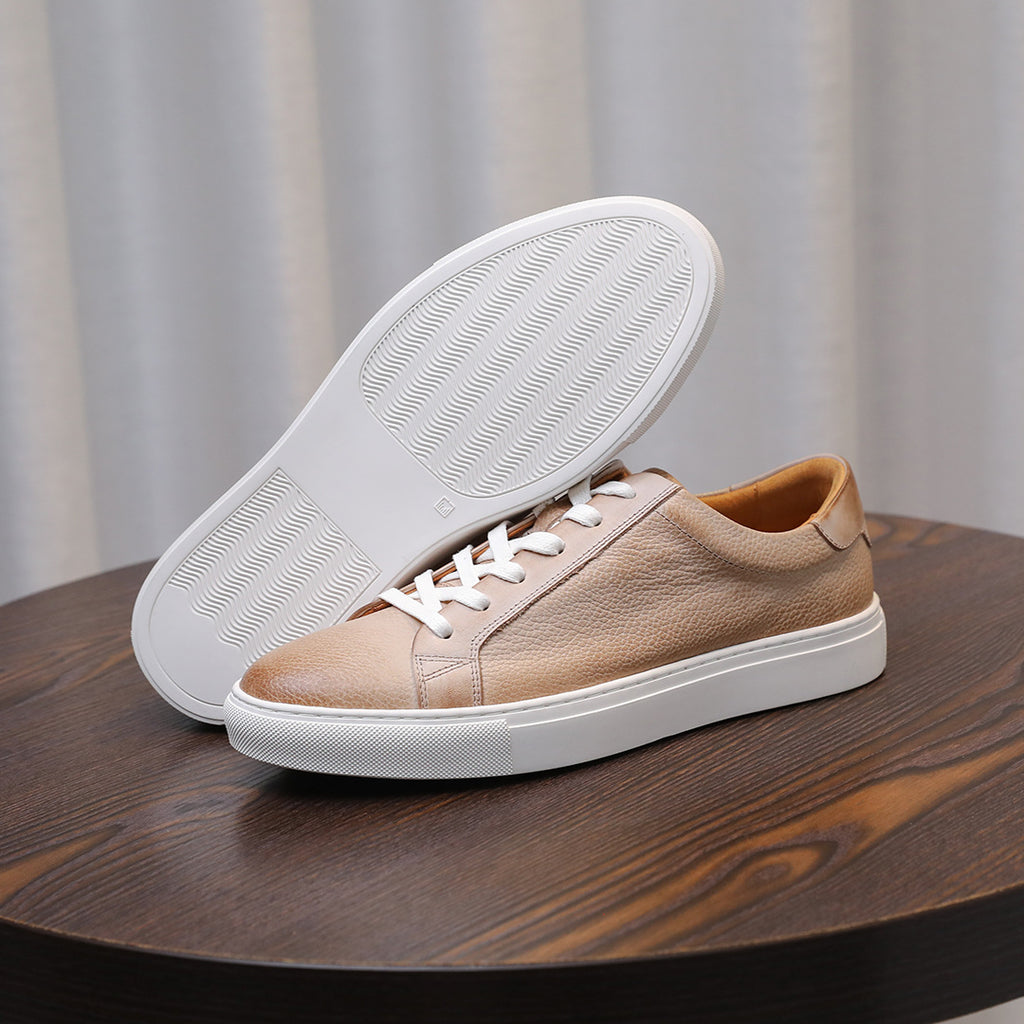 Men's leather sneakers, beige/tan, outsole view with treaded rubber sole