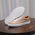 Men's leather sneakers, beige/tan, outsole view with treaded rubber sole