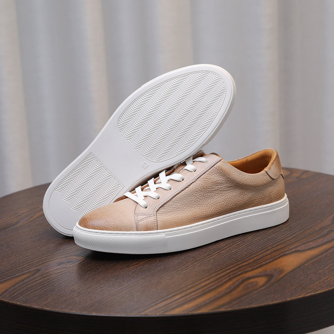 Men's leather sneakers, beige/tan, outsole view with treaded rubber sole