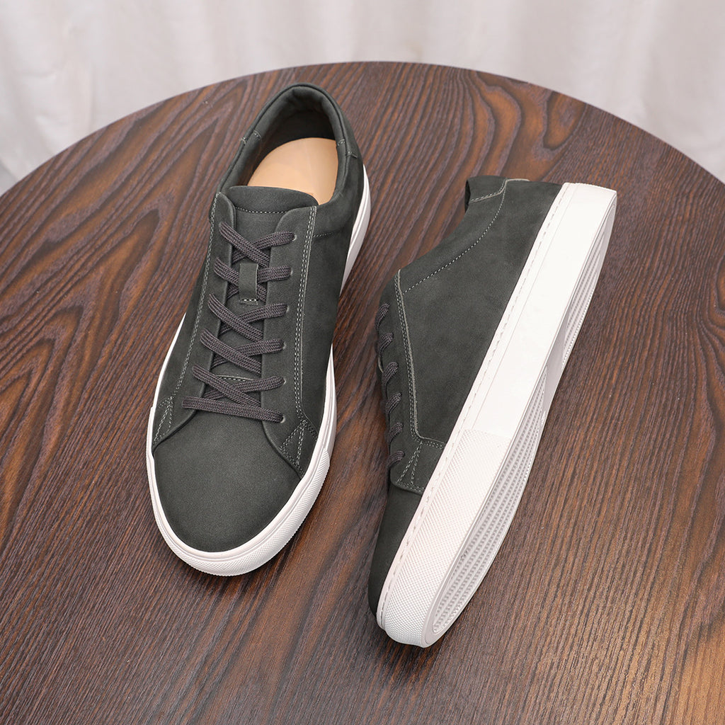 Dark gray suede leather sneakers with lace-up design and white rubber sidewall sole