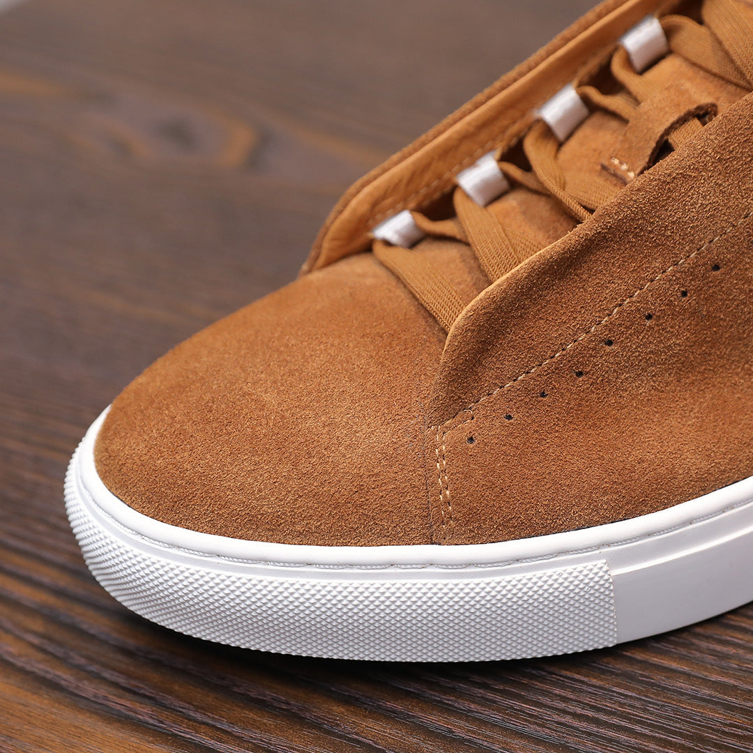 Men's brown suede leather sneaker with lace-up top and white textured sole edge