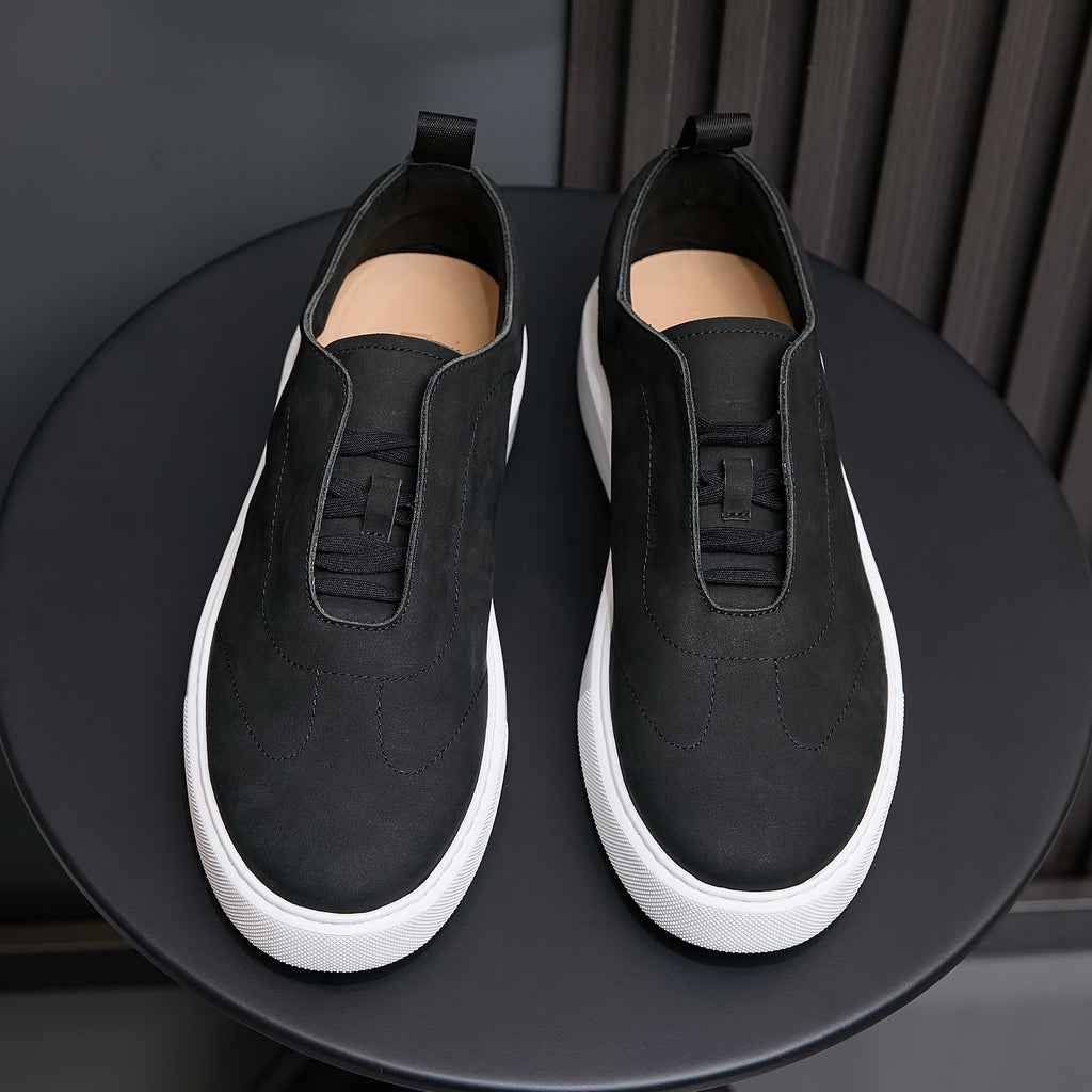 Men's black leather slip-on sneakers with elastic collar and white rubber sole.