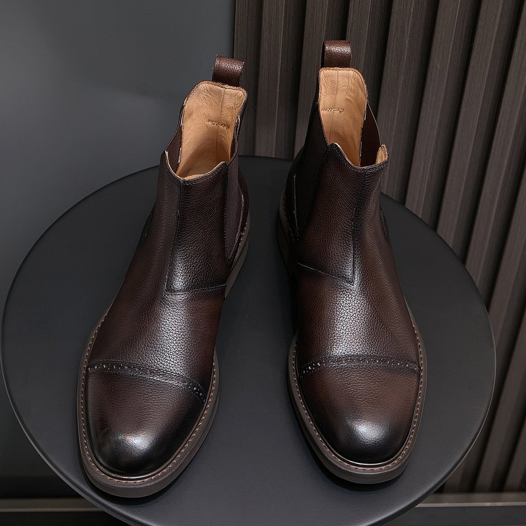 Men's dark brown Chelsea dress boots, front view with elastic gore and cushioned collar