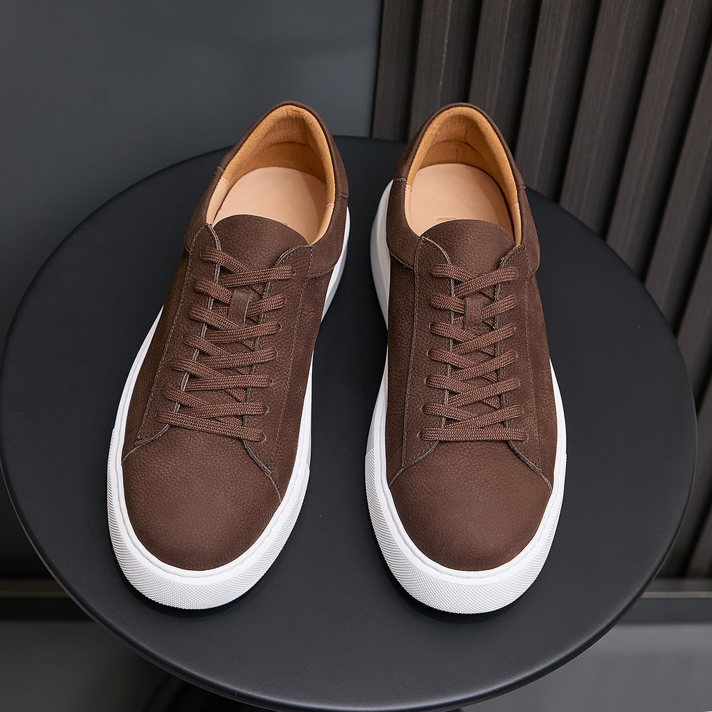 Men's dark brown leather sneakers, lace-up front view with white sidewall