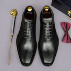 Men's black wingtip brogue oxfords, top view with lace-up details