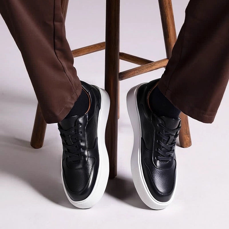 Men's leather sneakers, black, lace-up design with white rubber sole.
