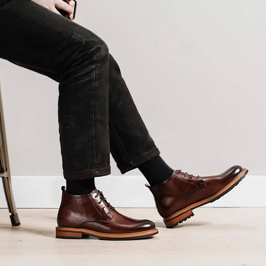 Men's brown leather chukka boots with plain toe and lace-up closure, chunky treaded sole